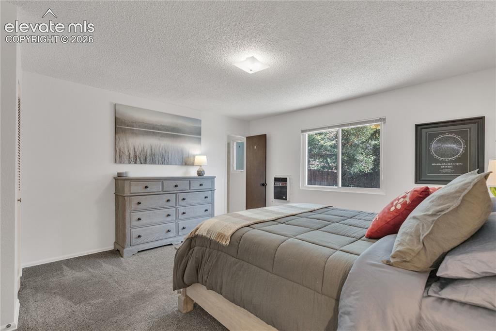 Image 13 of 30: Primary bedroom with en-suite bathroom