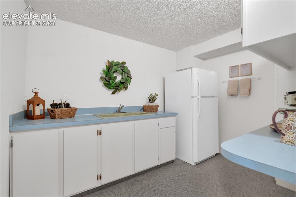 Image 22 of 30: Lower level Wet bar- great for multi- generation living