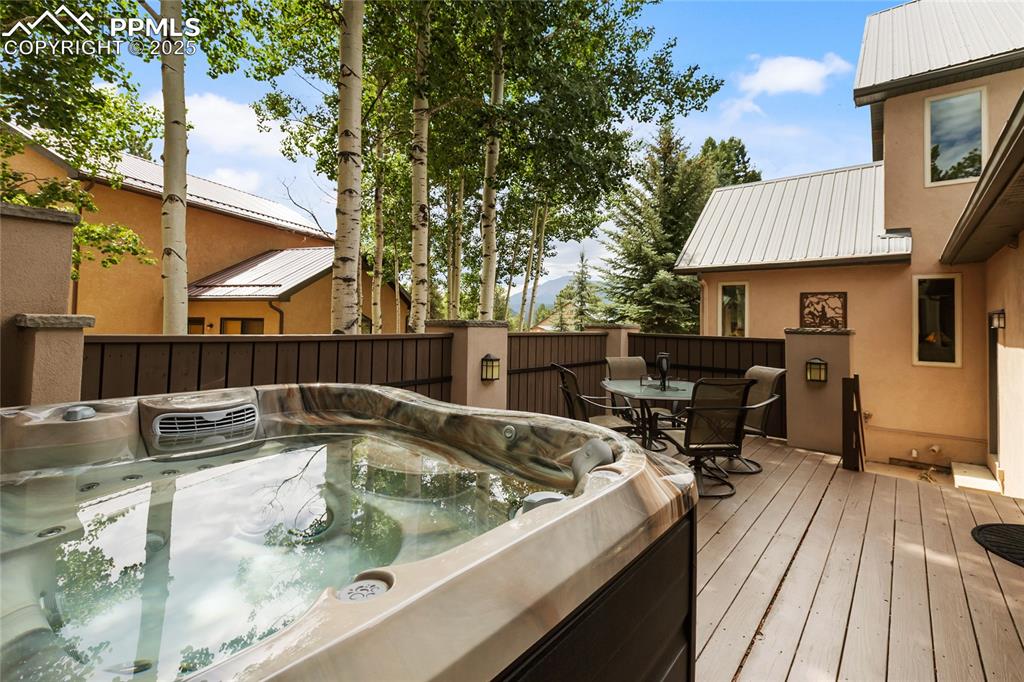 Image 21 of 46: The Perfect deck for an evening dip in the hot tub!