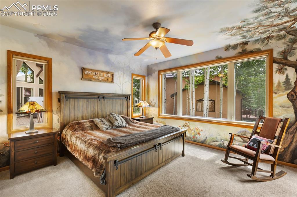 Image 27 of 46: Second Primary bedroom boasting an extraordinary setting