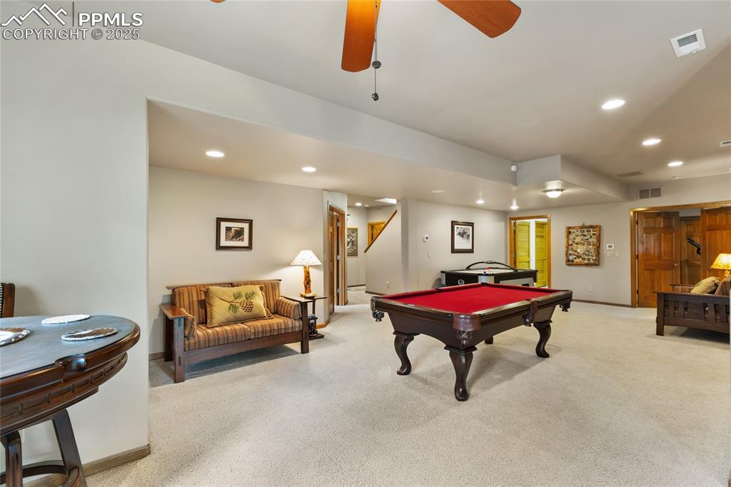 Image 36 of 46: Lower level family room/game room/entertainment area