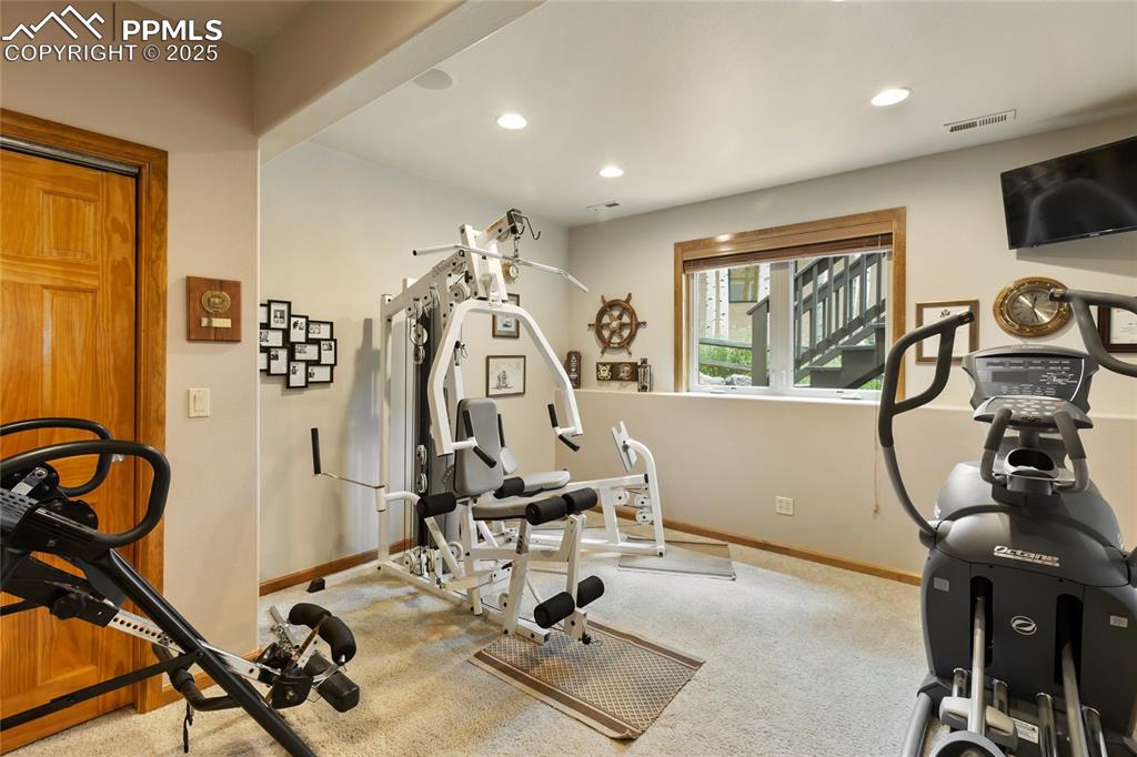 Image 37 of 46: One of two lower level bedrooms--also makes a great home gym