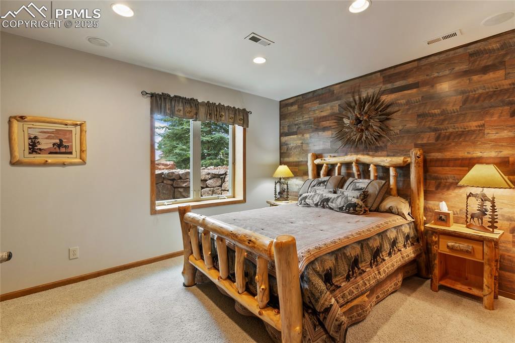 Image 39 of 46: Second of two lower level bedrooms