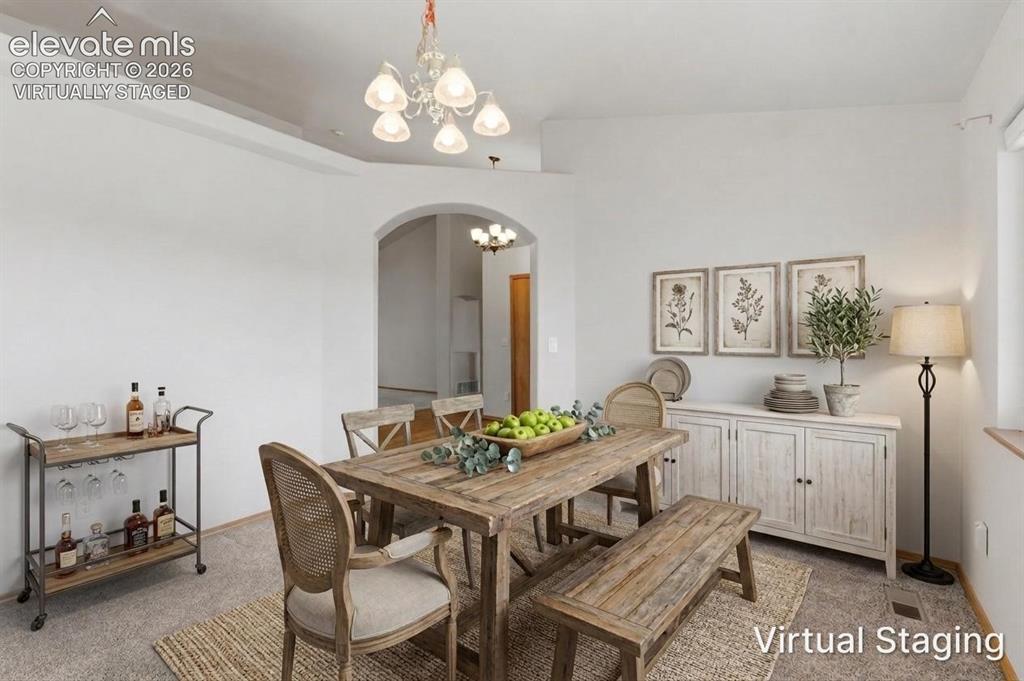 Image 13 of 50: Formal dining room virtually staged