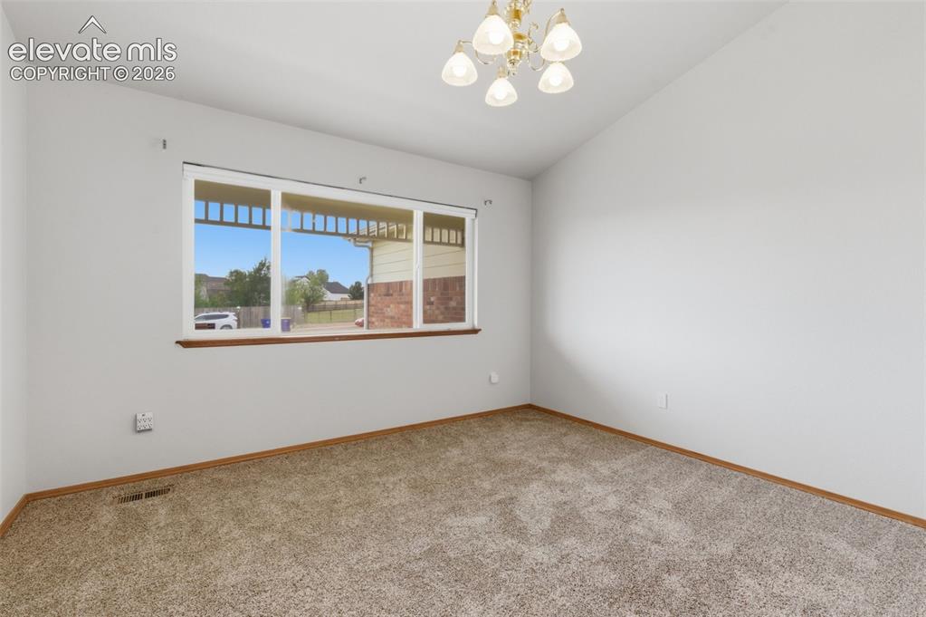 Image 14 of 50: Dining room, office or play room