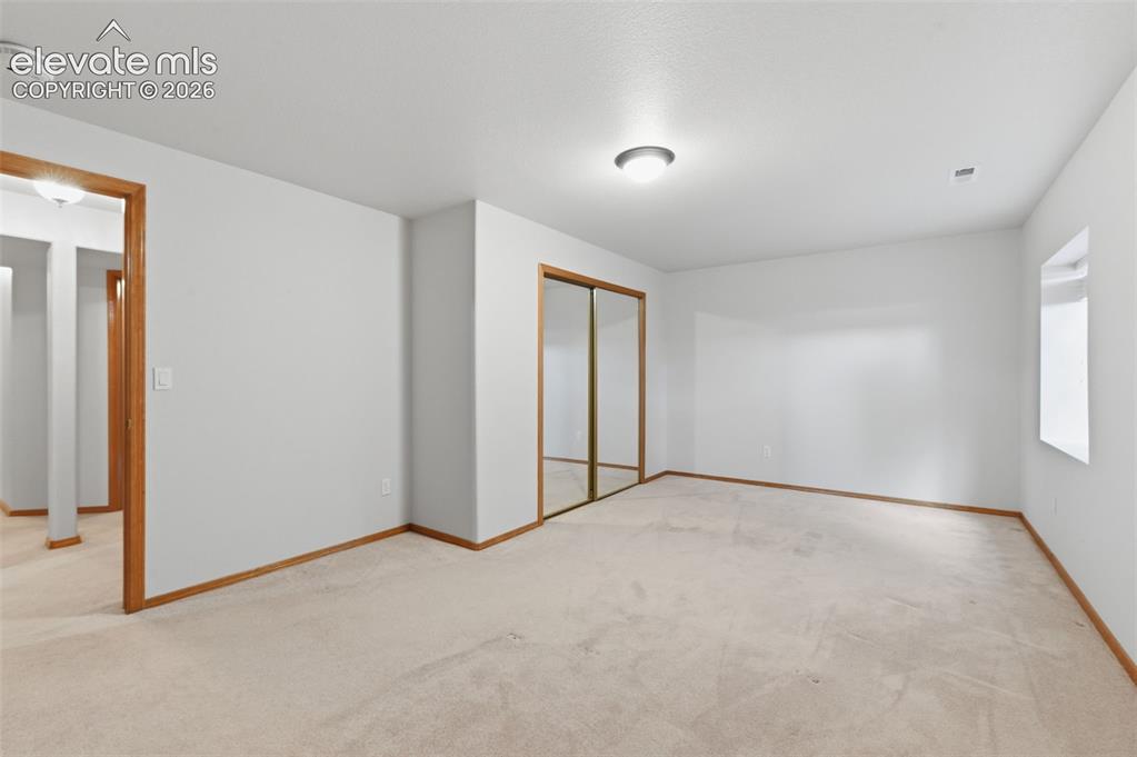 Image 36 of 50: 4th bedroom in basement