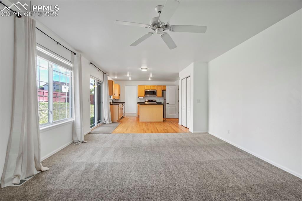 Image 17 of 48: Large family room that overlooks the kitchen.