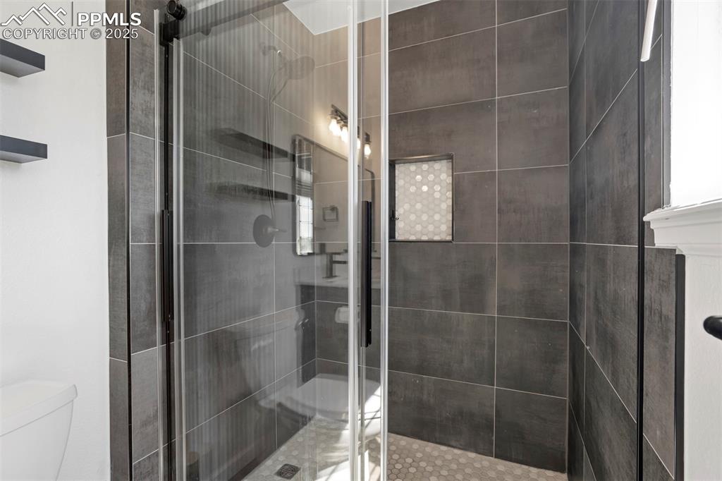 Image 25 of 48: Gorgeous slate tile primary shower
