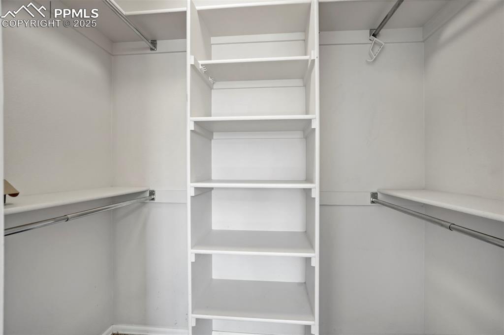 Image 27 of 48: Primary walk-in closet