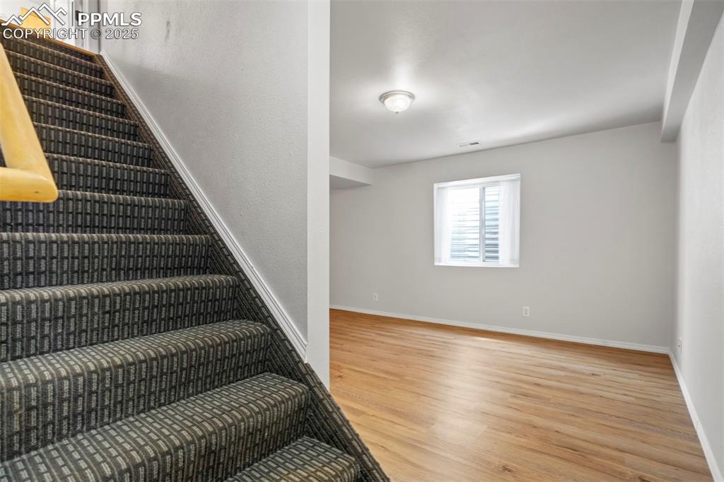 Image 35 of 48: New carpet on stairwell to basement great room