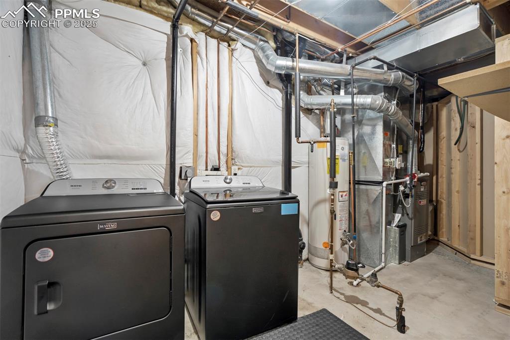 Image 44 of 48: Mechanical room with all new HVAC and new washer and dryer