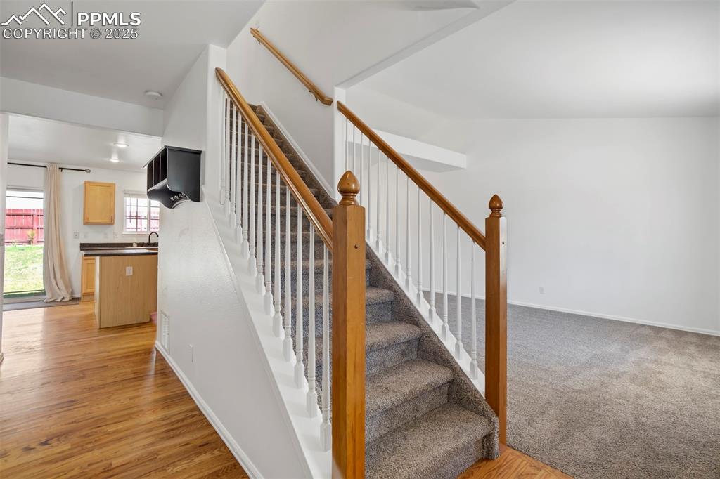 Image 9 of 48: Beautiful wood floors greet you as you enter the home.