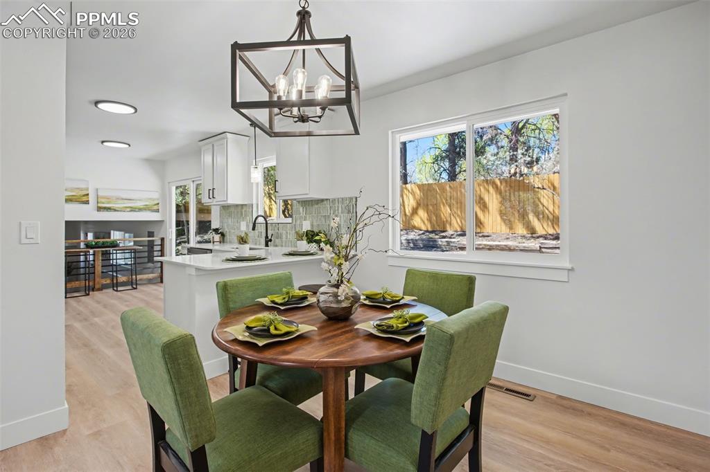 Image 9 of 47: Natural Light Pouring into a Warm, Inviting Dining Space