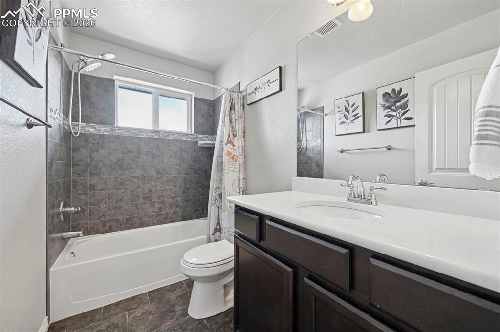 Image 33 of 49: Main level hall bath