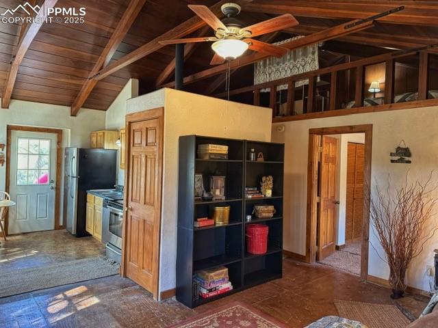 Image 5 of 15: Living room featuring a wooden ceiling with exposed beams, high vaulted cei