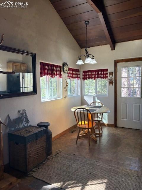 Image 9 of 15: Dining area featuring a wood ceiling with exposed beams and high vaulted ce