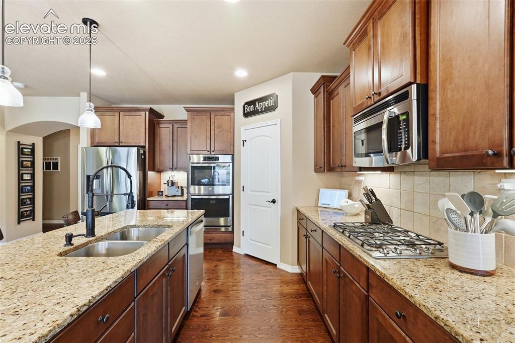 Image 14 of 47: Gas range, double ovens, walk-in pantry, new sink faucet, and new stainless