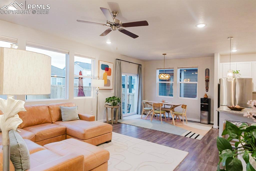 Image 12 of 37: The main floor has beautiful engineered wood flooring throughout.