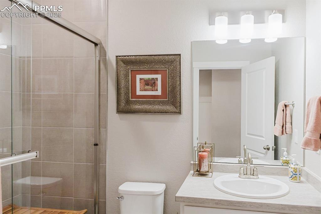 Image 15 of 37: This 3/4 bath serves the main floor bedroom.