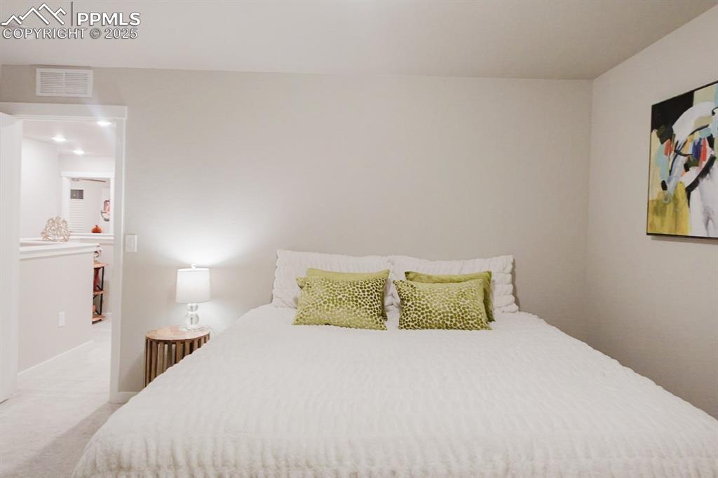 Image 25 of 37: This upstairs bedroom is big enough for a king-sized bed.