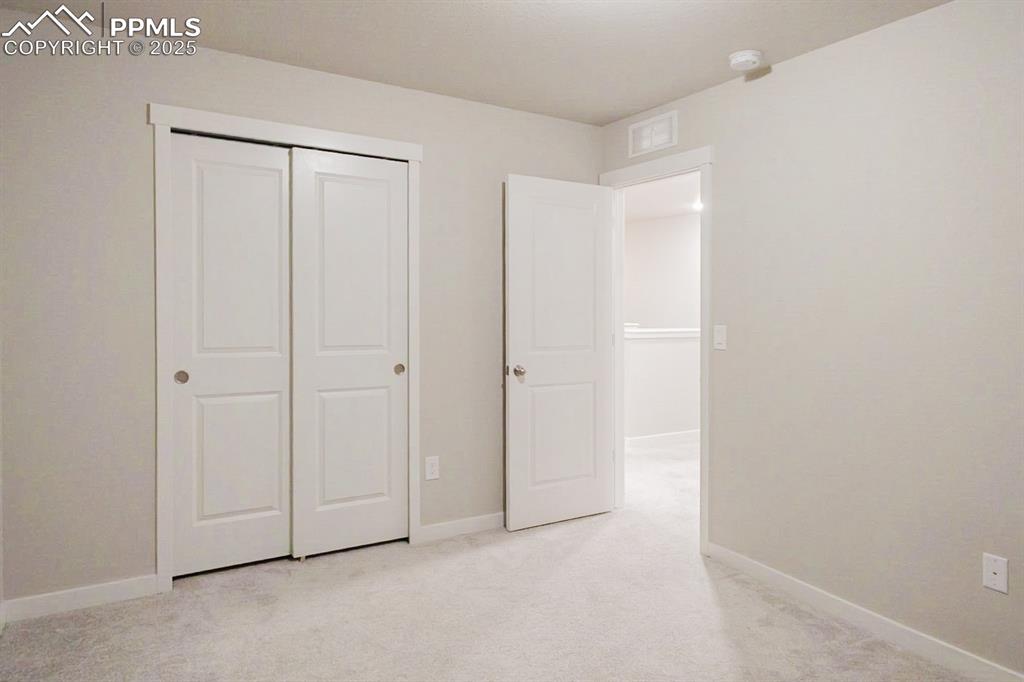 Image 27 of 37: This fourth bedroom is upstairs and has a big closet.