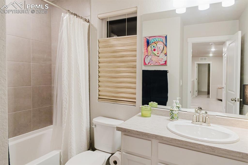 Image 28 of 37: This upstairs bathroom has a tub/shower combo and a nice vanity.