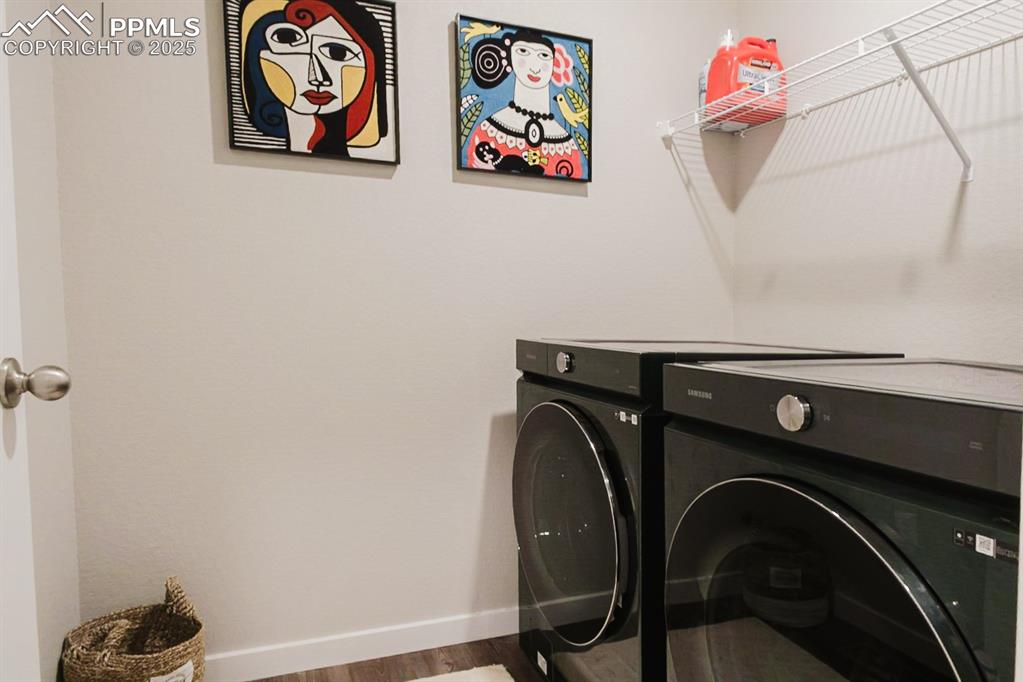 Image 29 of 37: The upstairs laundry is located near three of the five bedrooms for maximum