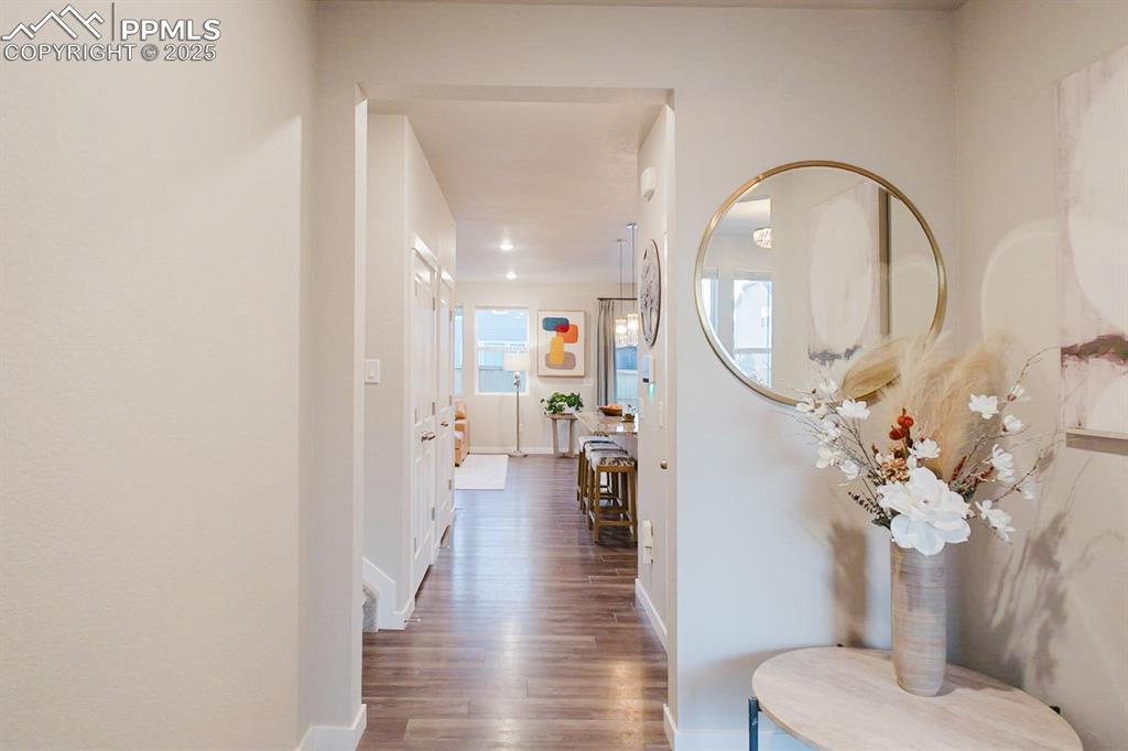 Image 3 of 37: The entry welcomes guests with elegance and style.