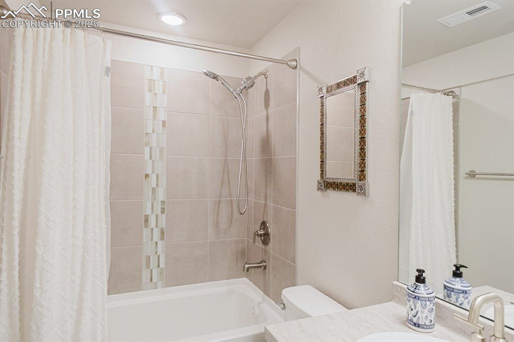 Image 34 of 37: This basement bathroom has a tub/shower combo.