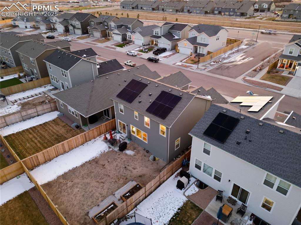 Image 36 of 37: The back yard is fully fenced and the solar panels will be paid off at clos