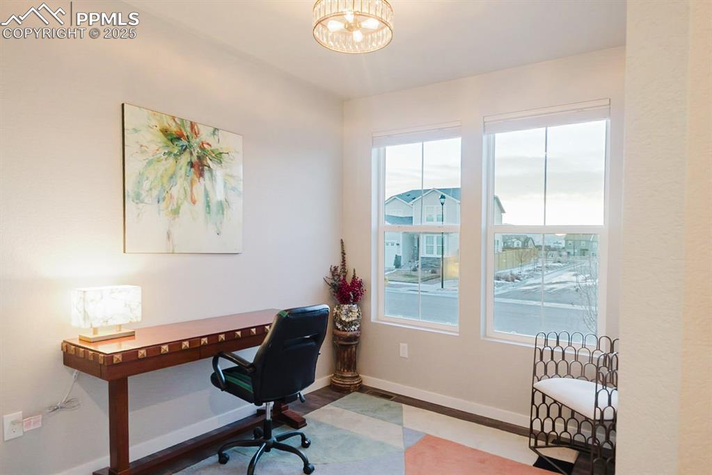 Image 4 of 37: This office is at the front of the home and includes a walk-in closet. It c