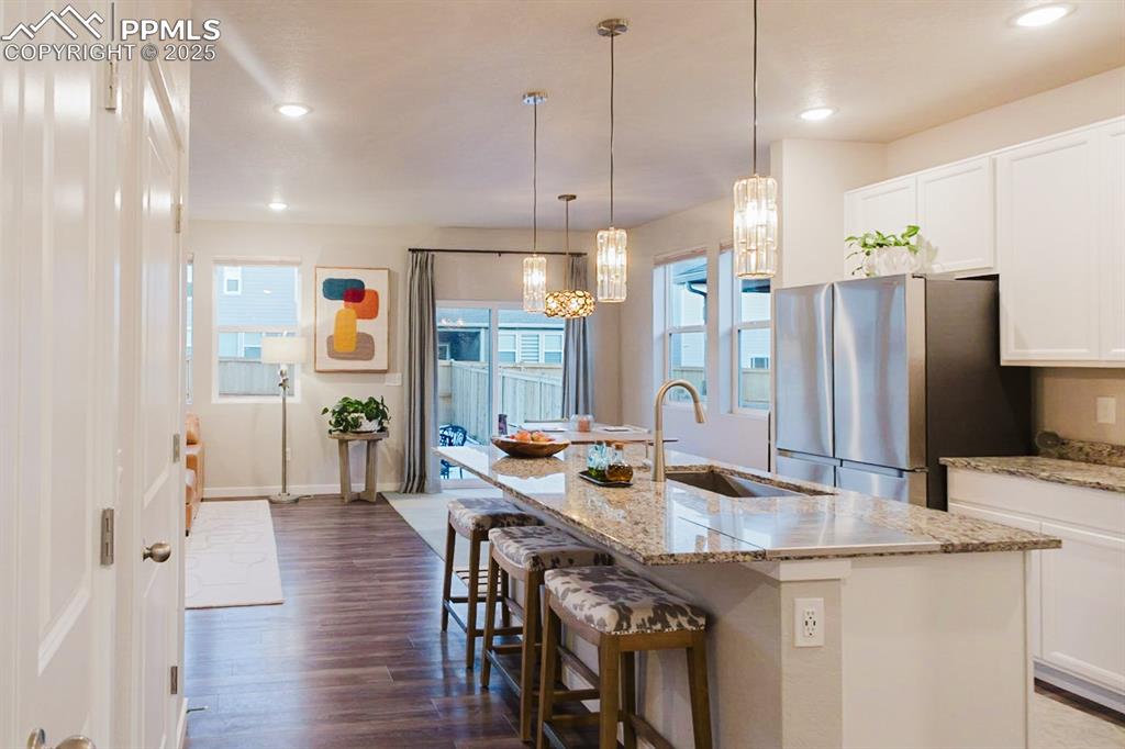 Image 7 of 37: The kitchen is spacious, modern and has a great layout.