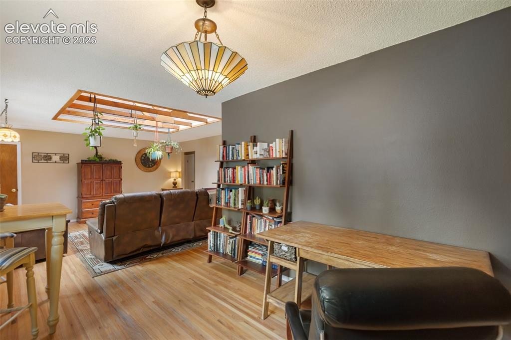 Image 6 of 36: Den, dining, or office area