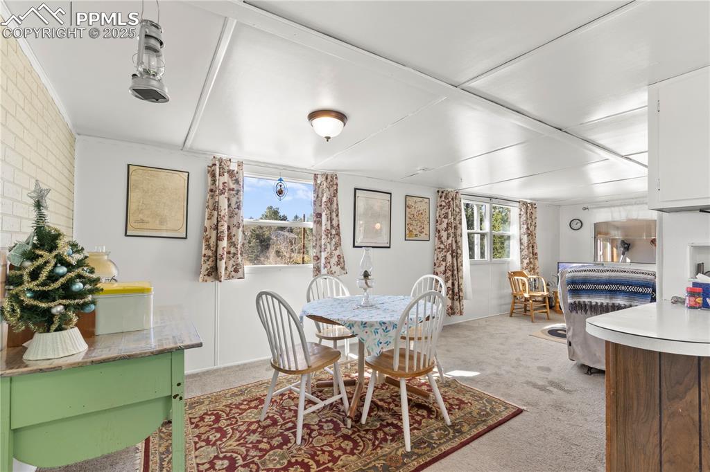 Image 15 of 31: Dining space with light carpet