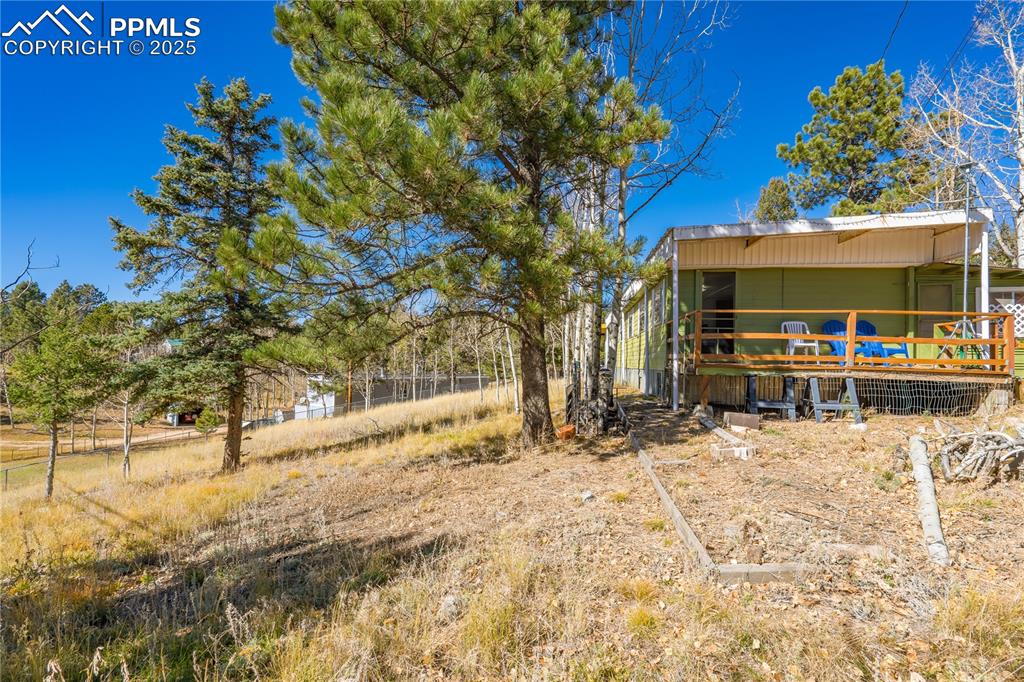 Image 23 of 31: View of yard with a deck
