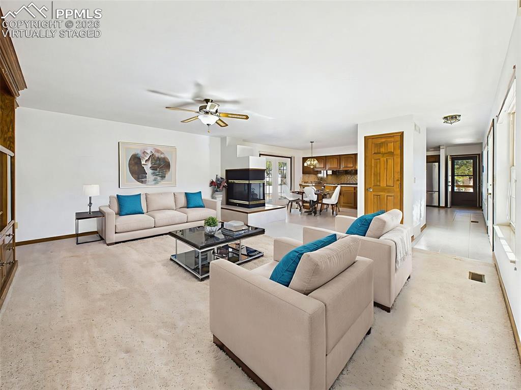 Image 16 of 50: Virtually Staged – View from the living area into the dining and kitchen zo