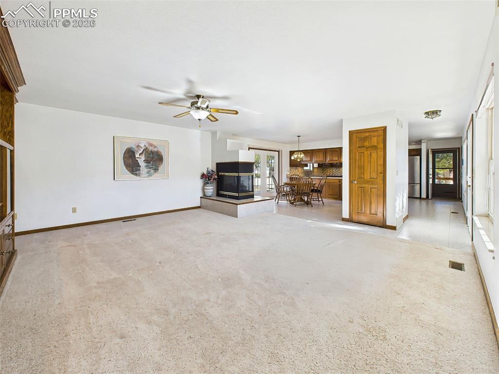 Image 17 of 50: Living + Kitchen Overview (Unstaged) – Seamless connection between the main