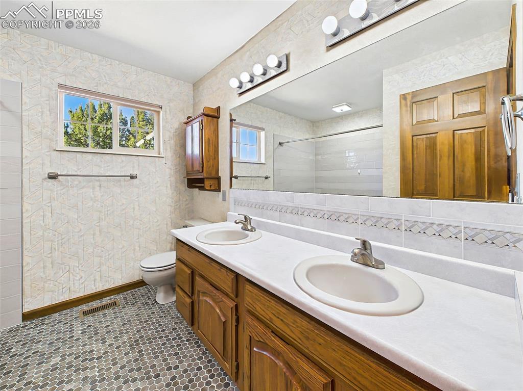 Image 20 of 50: Primary Bath – Vanity View – Dual-sink vanity with extended counter space a