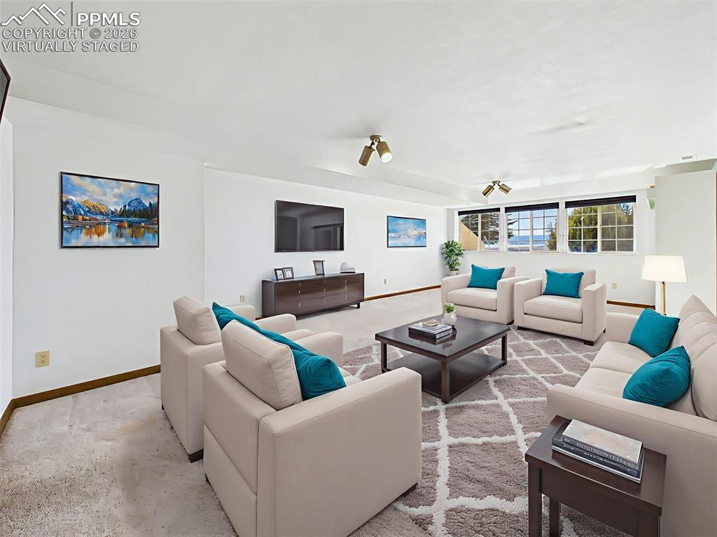 Image 30 of 50: Virtually Staged – Expansive basement living area staged with flexible spac