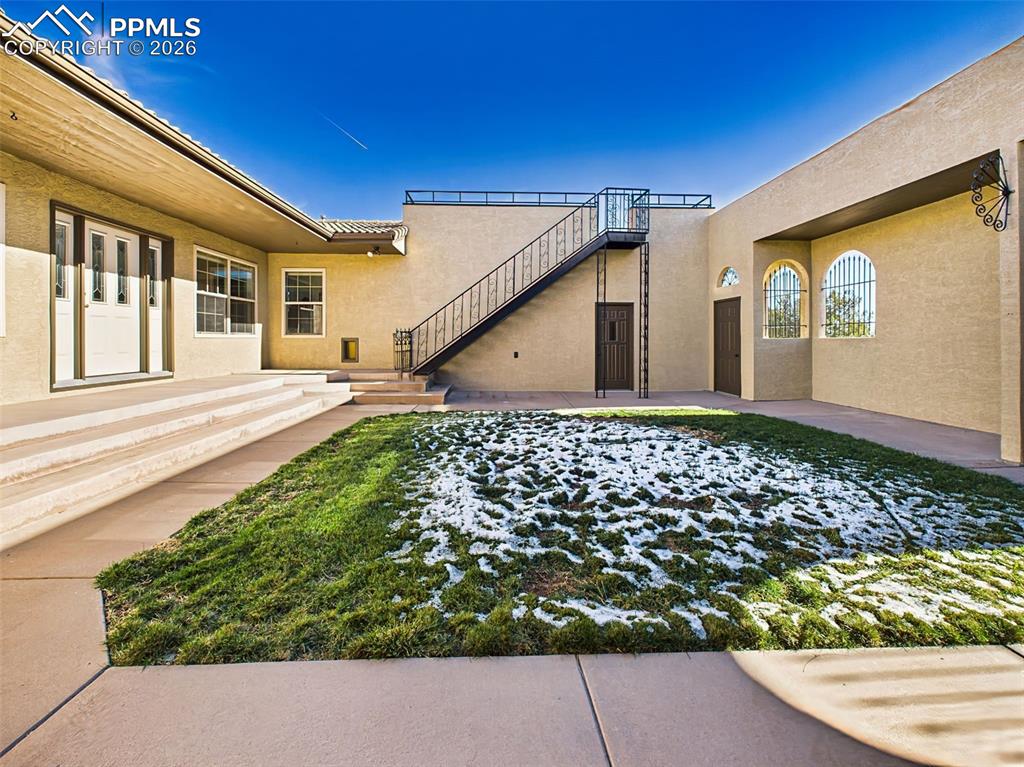 Image 35 of 50: Private Courtyard – This enclosed courtyard offers a unique blend of indoor