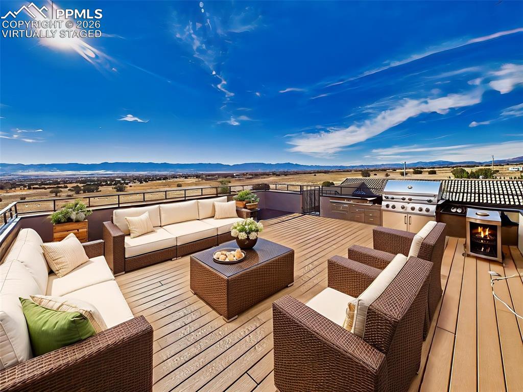 Image 36 of 50: Rooftop Deck (Virtually Staged) – Elevated rooftop deck with stunning 360-d