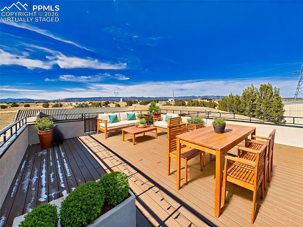 Image 38 of 50: Rooftop Deck (Virtually Staged – Dining View) – Another angle of the roofto