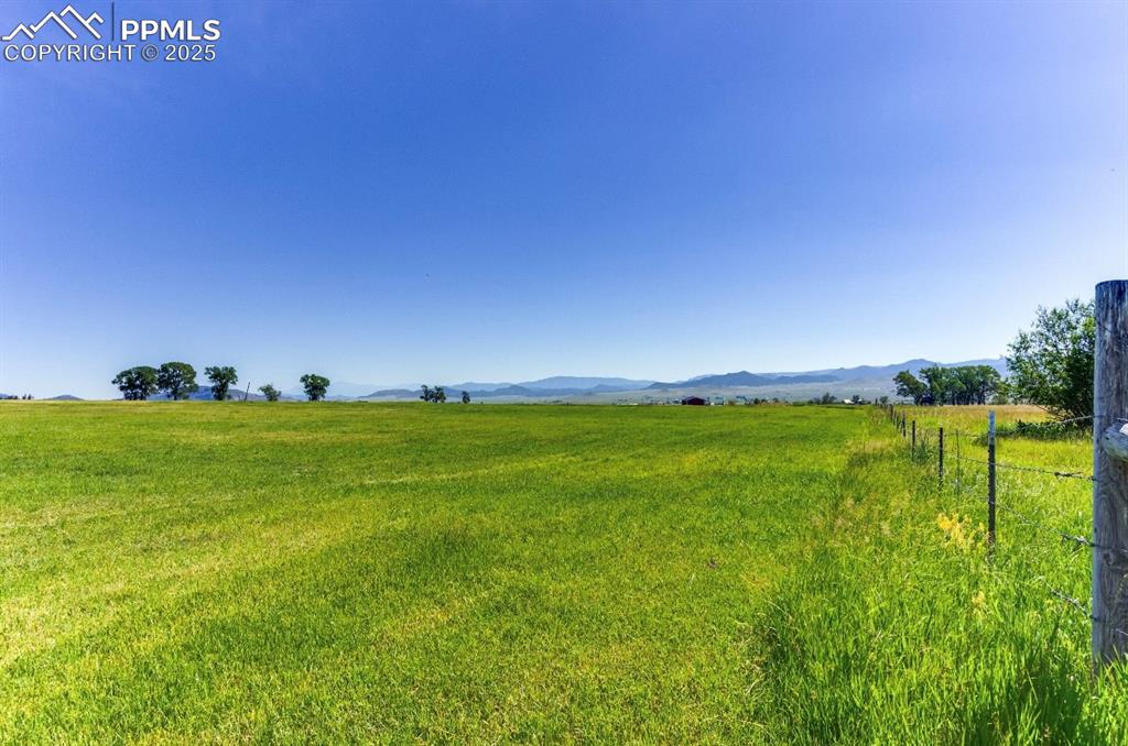 Image 3 of 26: View of yard with a view of rural / pastoral area and a mountain view