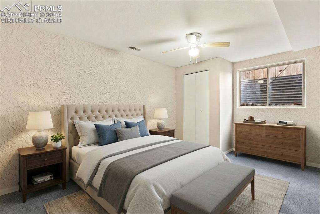 Image 21 of 27: Virtually staged basement bedroom