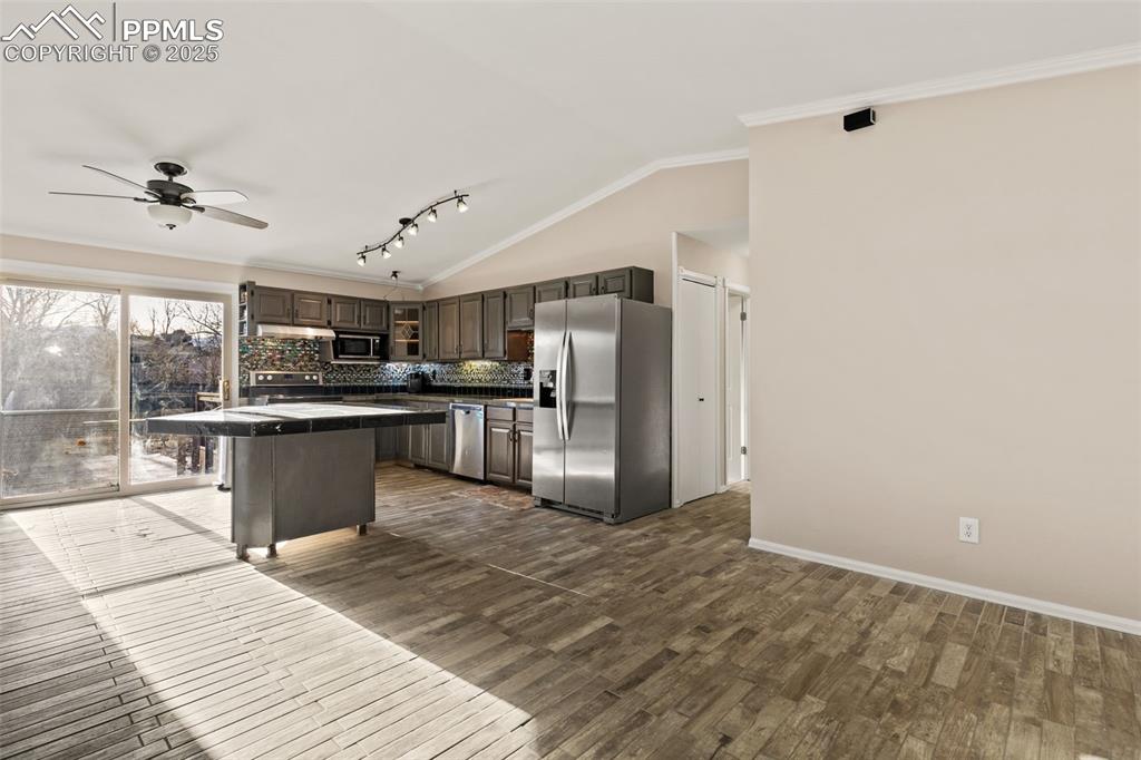 Image 4 of 27: Kitchen with granite tiles.