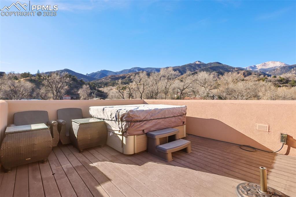 Image 16 of 19: Rooftop Deck featuring a mountain view
