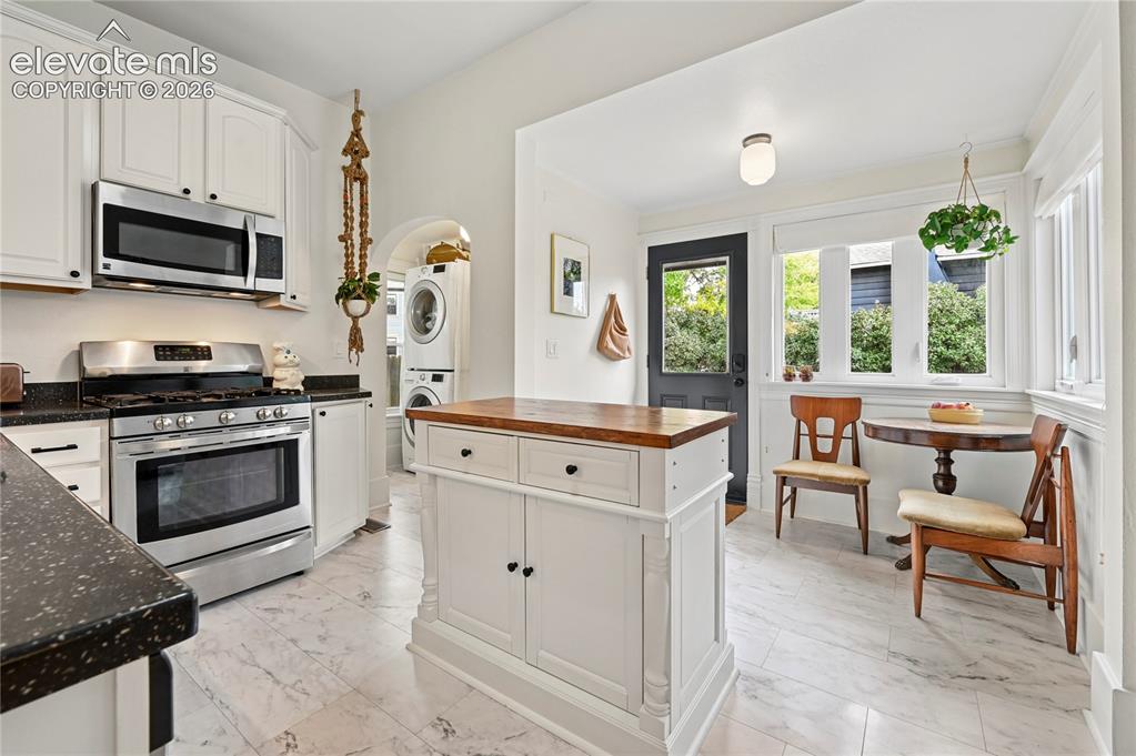Image 11 of 47: Looking at the Kitchen coming from the Dining Room