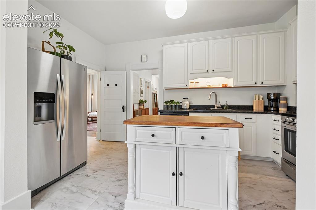 Image 12 of 47: Looking at the Kitchen from the eating area