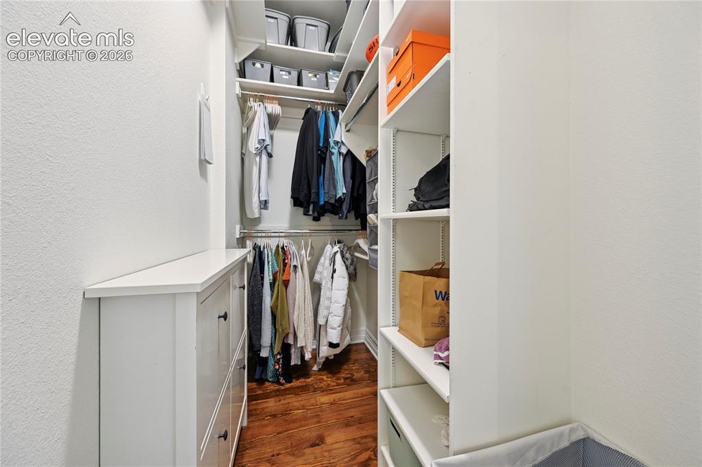 Image 28 of 47: Walk-In Closet in the Primary Bedroom