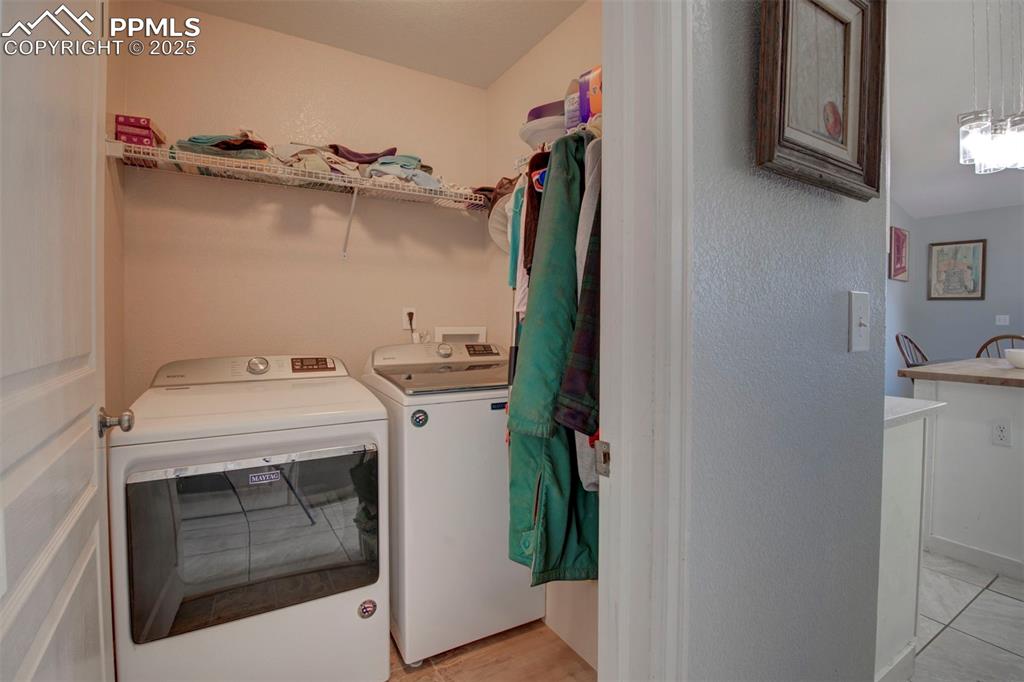 Image 20 of 44: Washroom with independent washer and dryer